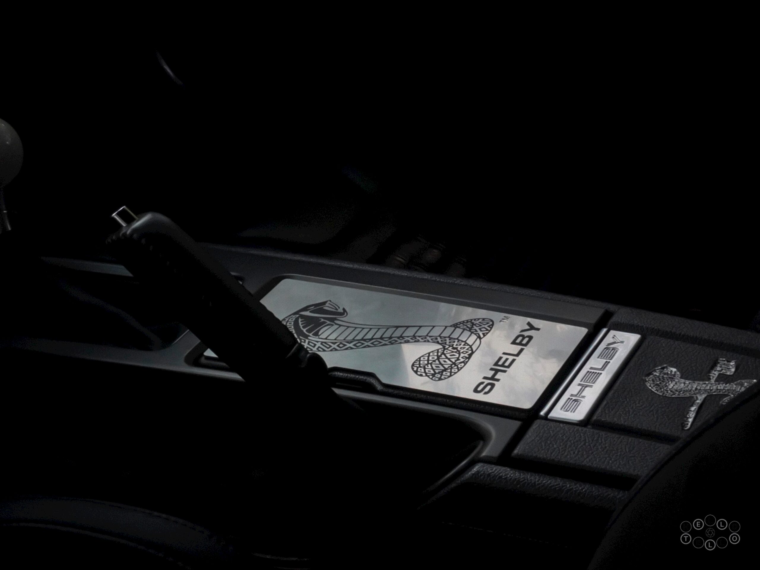 the steering wheel of a car in the dark